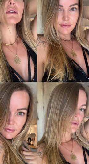 Blonde woman with tattoos in black top and gold necklaces taking selfies.