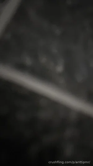 Blurred dark image with no clear subject or details.