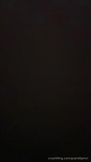 Dark image with no visible person or details.