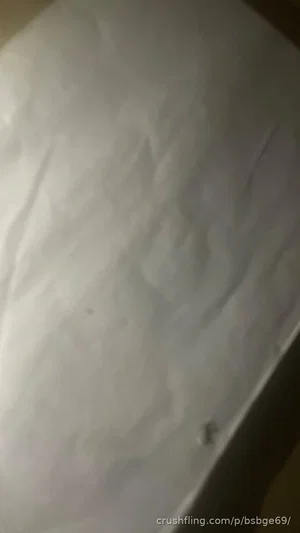 White sheet or fabric with wrinkles, no person visible.