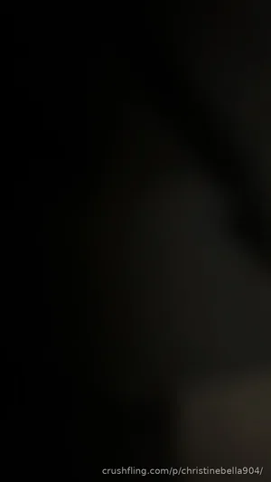 Very dark image with no clear person or details visible.