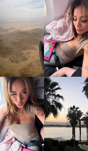 Blonde woman with tattoos in beige top on airplane.