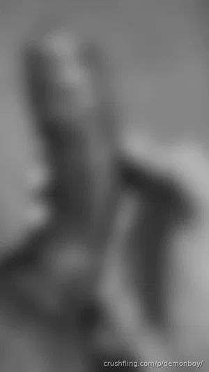 Blurred grayscale image of a person, details indiscernible.