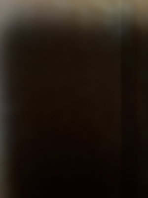 Blurred image with no discernible person or details.