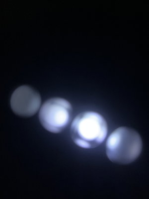 Blurred circular lights on black background.