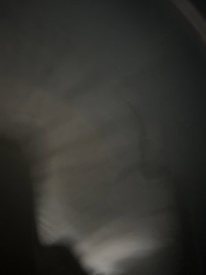 Blurry dark image of indoor staircase.