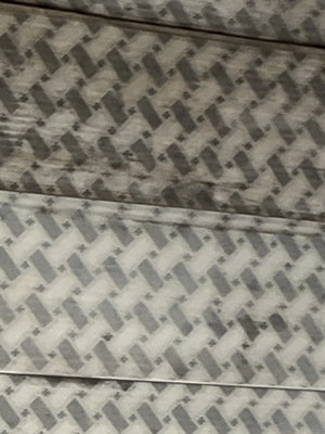 Close-up of gray herringbone wooden surface.