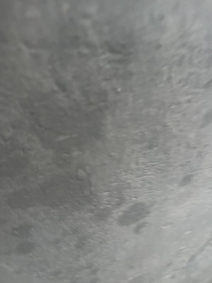 Gray textured concrete surface.