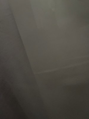 Blurry indistinct surface with no visible person.