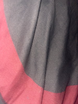 Close-up of pink and gray fabric, possibly clothing or bedding.