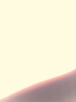 Close-up of skin curve against light background, no distinct features visible.