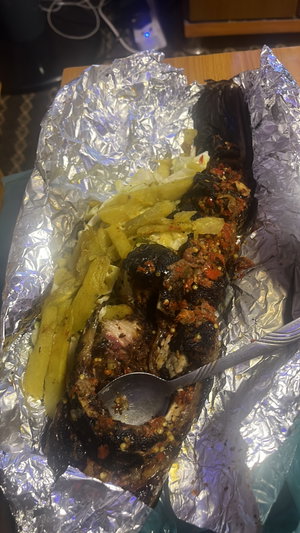 No person; grilled eggplant with potatoes on table.