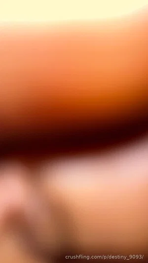 Blurred close-up of skin tones, possibly arm or torso, no clear features.