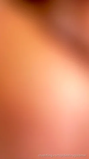 Blurred close-up of skin tone, no identifiable features or context.