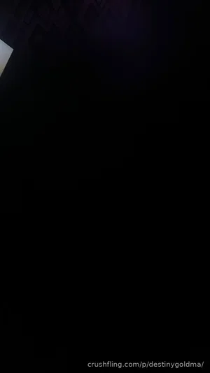 Dark image with no visible person or details.