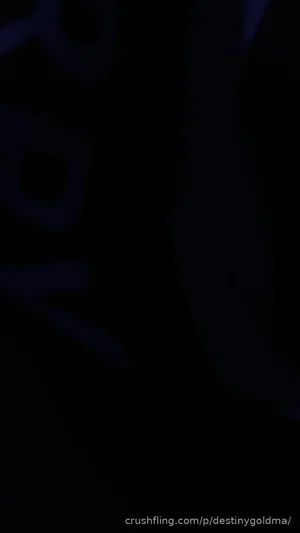 Dark, indistinct image with no clear person or setting visible.