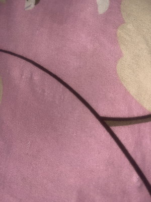 Close-up of pink patterned fabric.