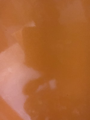 Blurred close-up of skin tones with no identifiable person or features.