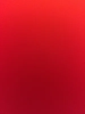 Solid red background.