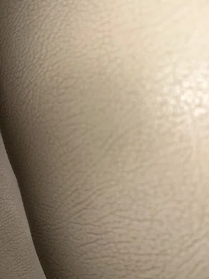 Close-up of skin texture on a person's body, possibly thigh or buttock, with no clothing visible.