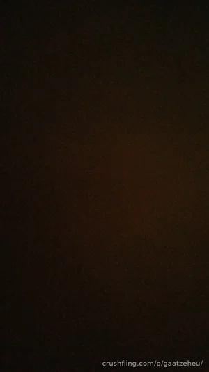 Dark, indistinct image with no visible person or details.