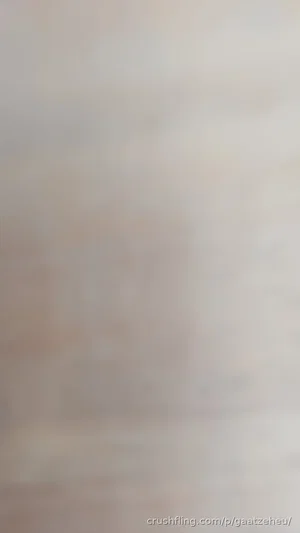 Blurred image with no discernible person or object.