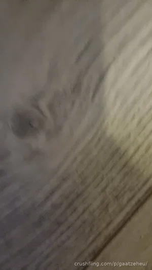 Blurred image of a person, indistinct features, unclear setting.