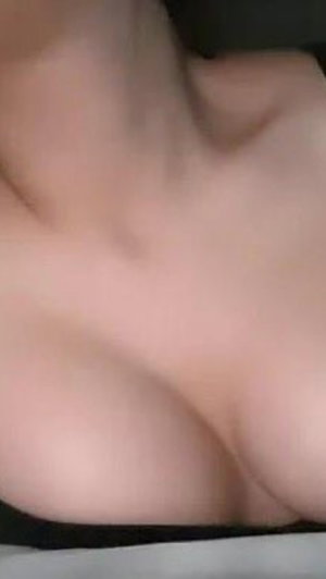 Close-up of bare chest skin in low light.