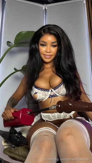 Woman with long black hair in white lace lingerie and thigh-high stockings, holding a toy in a