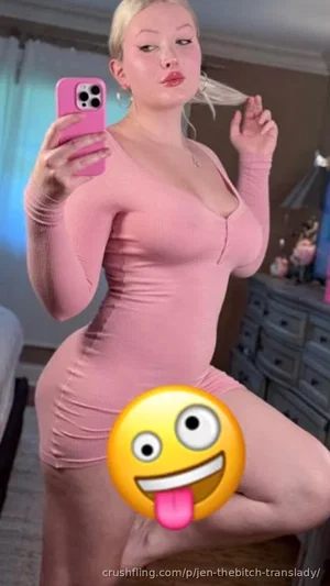 Woman in pink bodysuit taking mirror selfie in bedroom.