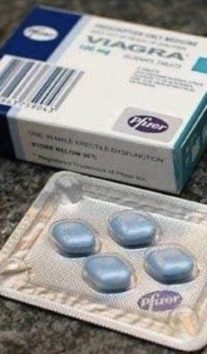 Viagra 100mg box and blister pack of blue pills.