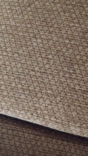 Close-up of brown textured fabric.