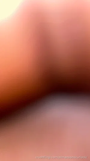Blurred close-up of skin tones, no identifiable features or context.