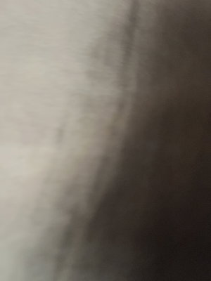 Blurry close-up of indistinct surface