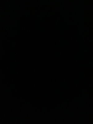 Solid black image with no visible content or person.