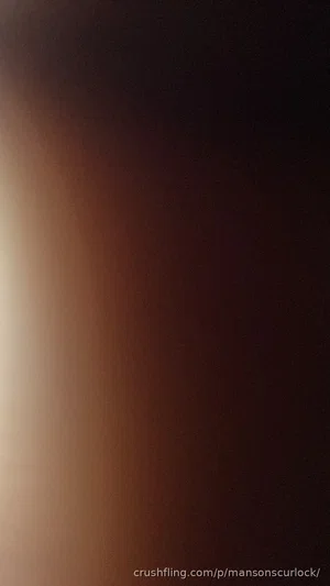 Blurred image with no discernible person or object.