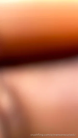 Blurred close-up of skin tones, no identifiable person or features.