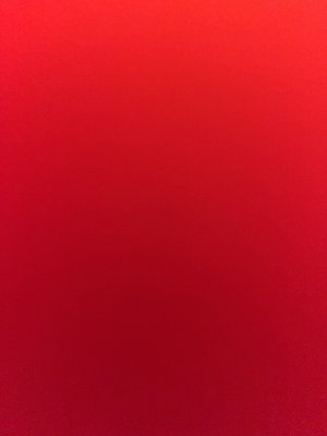Solid red background.