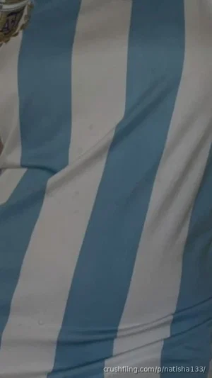 Close-up of blue and white striped fabric, possibly clothing, with slight wrinkles.