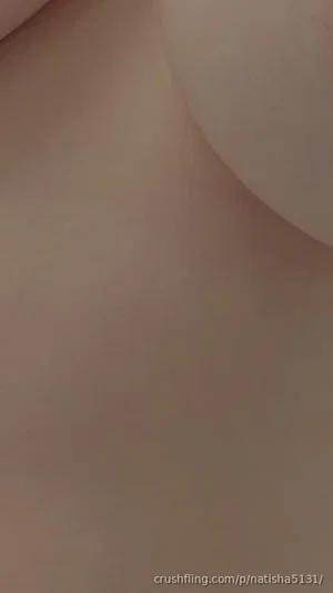 Close-up of bare skin, possibly breast or torso, no clear features visible.