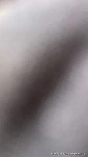 Blurred close-up of skin or fabric, no clear person or setting visible.