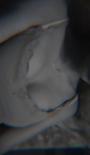Blurry close-up of curvy woman's lower body.
