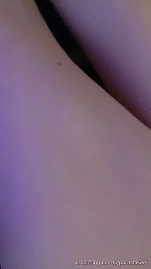 Close-up of bare skin with purple lighting, possibly torso or leg.