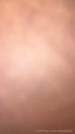 Blurred close-up of skin tone, no distinct features visible.