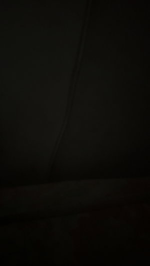 Black image, no content or person visible.