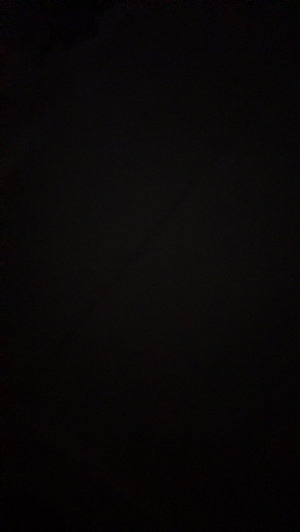 Dark image with no visible person or details.