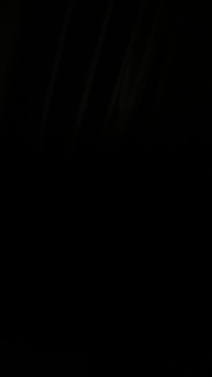 Dark image with no visible person or details.
