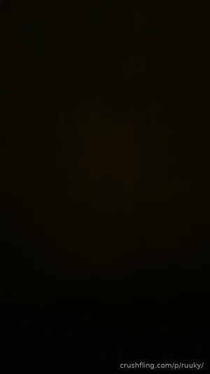 Dark image with no visible person or details.