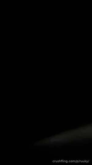 Dark image with no visible person or details.