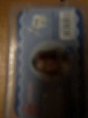 Blurred ID card with photo on wood surface.